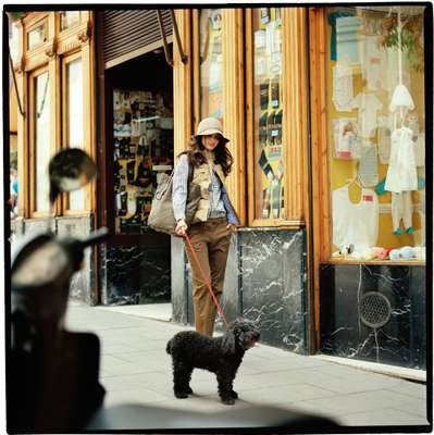 Hat by Toujours, vest by Penfield, shirt by Melograno Editions, trousers by C.P. Company, bag by Closed