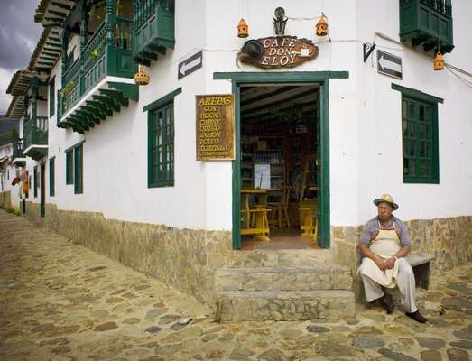 Owner Eloy sat outside his coffee shop