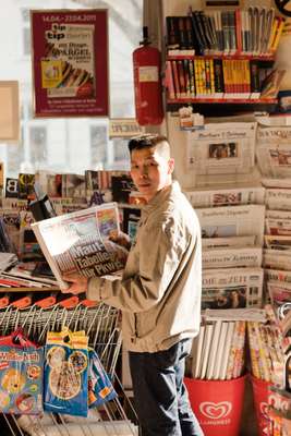 Van Dan Le who owns a newspaper kiosk in Prenzlauer Berg