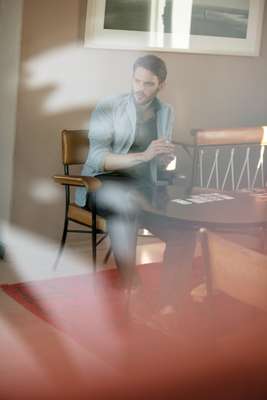 Jacket by Beams+, shirt by Prada, jeans by Albam, shoes by Shöfolk