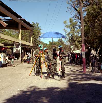 Brazilian engineers surveying a road for tarmacking, Croix-des Bouquets