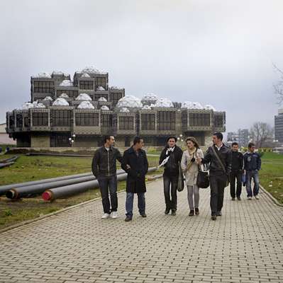 Students with Pristina’s library in the background
