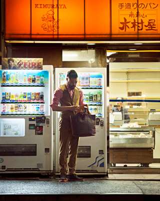 Jacket, vest and trousers by Ermenegildo Zegna, shirt by Comme des Garçons Homme, bag by Porter, shoes by Visvim