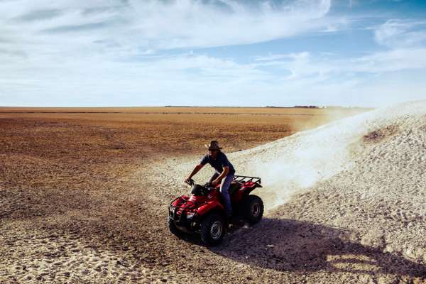 Leigh Spriggs, a farmer at Connemara, on his quad bike