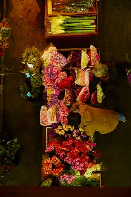 Buyers looking through the flowers on offer