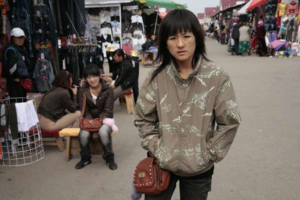 Chinese migrants at a market in the suburbs