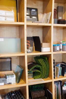 Balmori's offices are lined with shelves containing samples of working materials