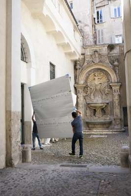 Technicians in the gallery courtyard