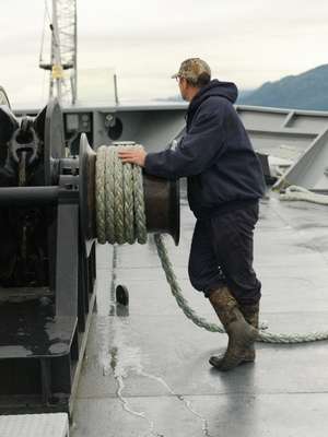 A deck winch tightens Columbia’s tie-up lines