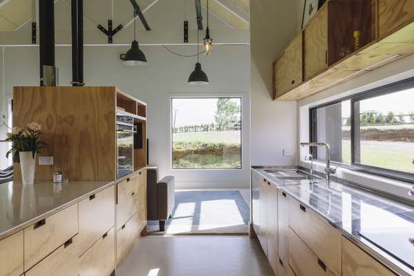 Plywood kitchen complements the exterior style