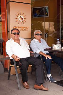 George and Morris enjoy their Sunday morning coffee in  Sassine Square