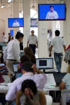 Journalists file their stories at the Summit of the Americas 