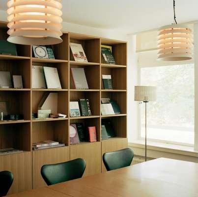 Winkreative’s meeting room has Blumer Schreinerei shelving, a Novex conference table, Fritz Hansen chairs and lighting by Santa & Cole