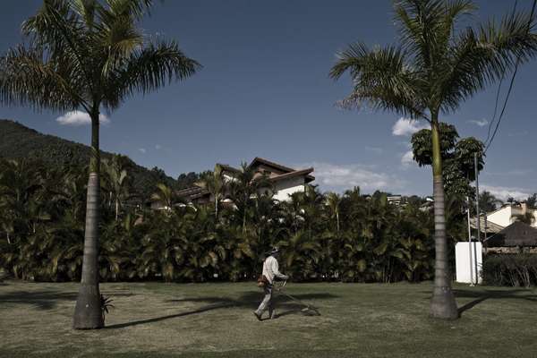 Every day 130,000 workers enter AlphaVille – this gardener is one of them