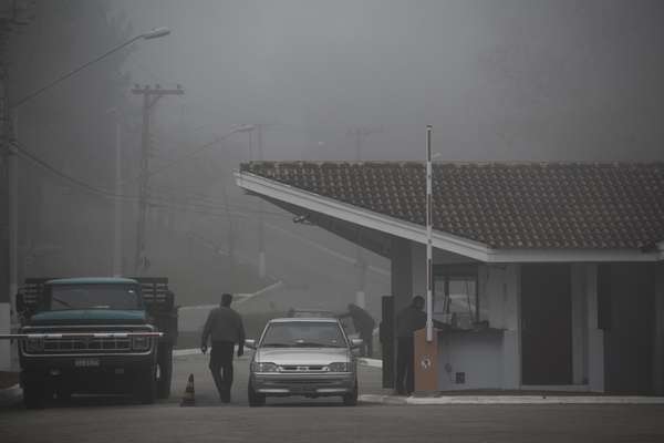 Security personnel halt incoming traffic arriving for work