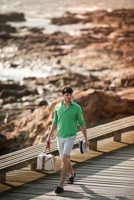 POLO SHIRT by Hackett, SHORTS by Polo Ralph Lauren, SHOES by A.P.C., BAG by Delvaux, HAT by Bernstock Speirs from Tomorrowland