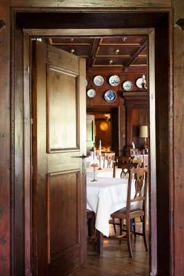 The dining room is lined with a porcelain collection