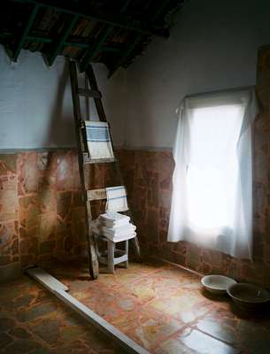 The floor of the bathroom is red marble