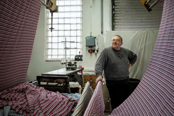 A machine operator at the Sinka Es Tarsa textile factory