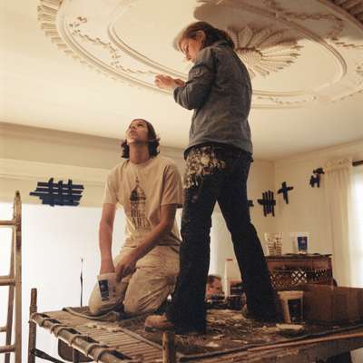 Benjamin Smiley and Emily Gillett working on plaster