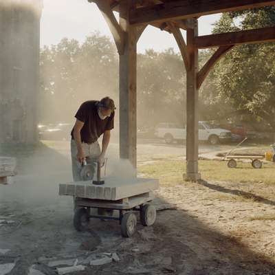 Simeon Warren, dean of the college, carving stone 