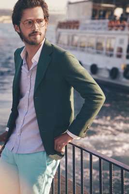 Glasses by Michel Henau, jacket by Sartorio, shirt by Maison Kitsuné, shorts by J.Crew