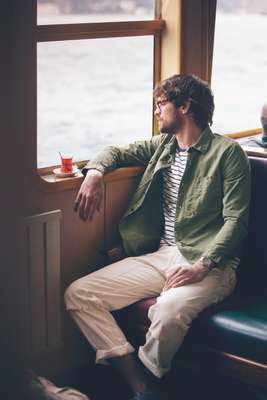 Glasses by Michel Henau, shirt by Closed, t-shirt by Sunspel, trousers by Engineered Garments, shoes by Church’s, watch by Gucci