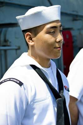 Asian-American crew members report to the flight deck to greet their Hong Kong guests