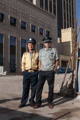 Security guards outside the construction site of the Radisson Blu hotel