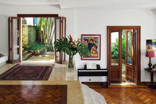 Reception: The split-level reception leading into the bedrooms and the pool house above retains all the original features including marble steps and jatoba (cherry) flooring