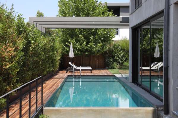 Iroko decking surrounds Woodwing pool