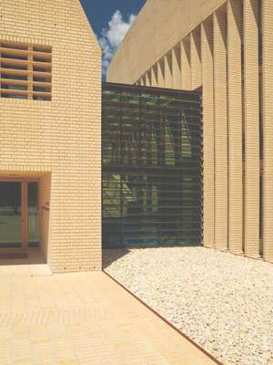 Glass corridor links the two buildings of the complex