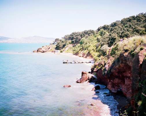 Cliffs overlook a beach on Heybeliada