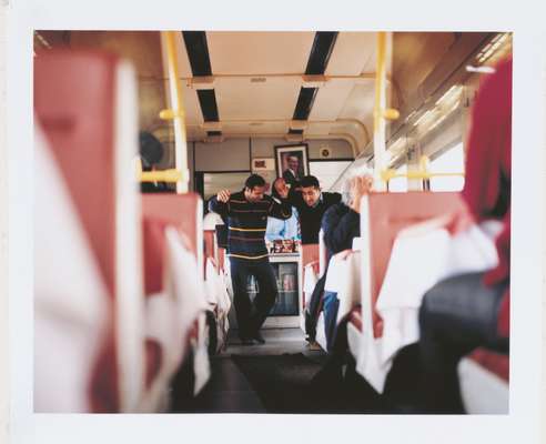 Iranian Hassan Nasiri and train steward Ergun Koc dance in the dining car