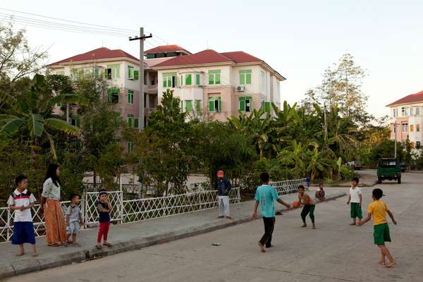 Children play in an apartment complex in Lal Way district