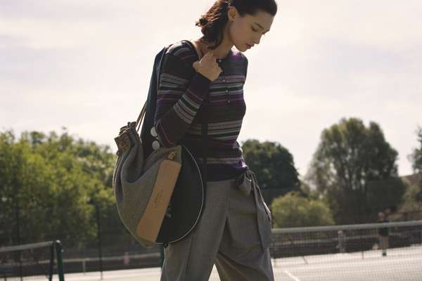 Jumper by John Smedley, trousers by Incotex, bag by Bill Amberg, racquet bag by Yonex