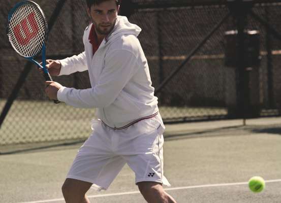 Jacket, racquet and ball by Wilson, polo shirt and shorts both by Yonex