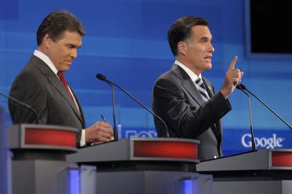 Mitt Romney (right) during a 2011 debate
