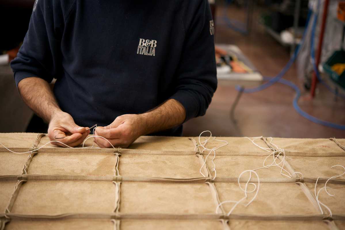 Leather upholstery is sewn by staff