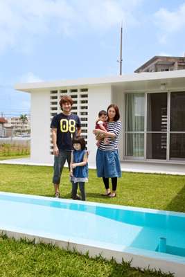 Hairdresser Shigeo Shima with his wife Ayumi and their children