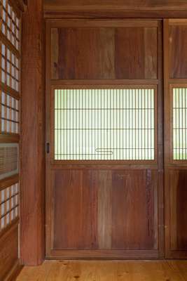 Sliding doors are one of many traditional features in Smiles’ lakeside retreat 