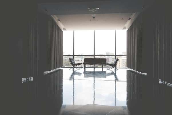 Cluster of Barcelona chairs in hallway