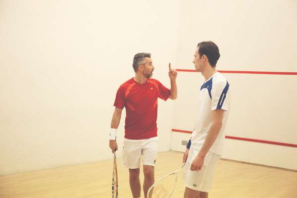  Ben wears red t-shirt by New Balance, shorts by Lotto, wristband and shoes by Nike, racquet by Wilson