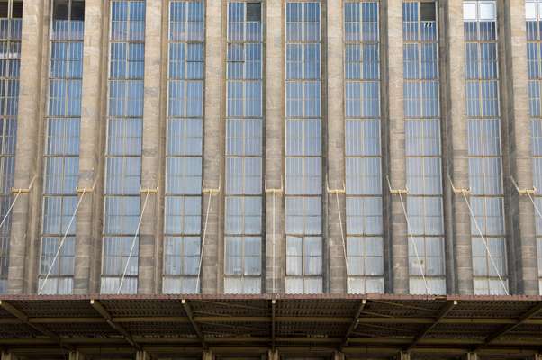 Narrow windows reach up to the top of the airport’s structure
