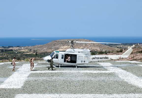 Major General Kristin Lund, the first ever female commander of a UN peacekeeping mission, boarding a helicopter to patrol the Buffer Zone