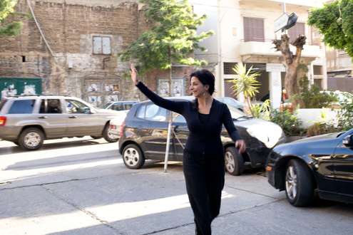 Zeina Daccache waves while walking in Beirut’s Mar Mikhayel neighbourhood