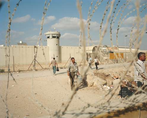 Palestinian workers cross the wall   