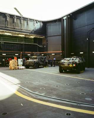 Combat vehicles in a hangar on one of ‘Cavour’s’ 30-tonne elevators 
