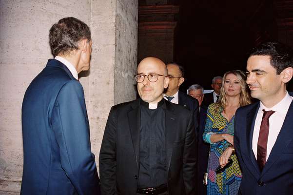 In Rome, the night doesn’t begin until a priest shows up