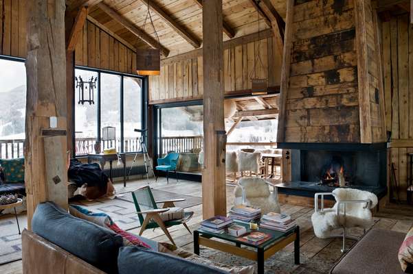 The central living area, complete with fireplace and a mix of vintage furniture